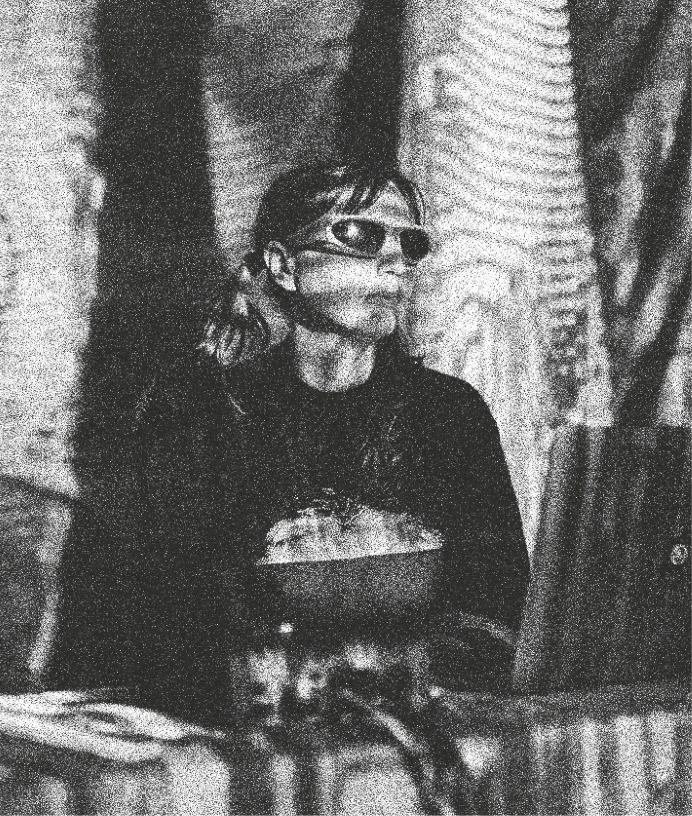 Black-and-white portrait of a person wearing sunglasses at a Lumen event.